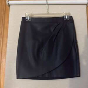 Black faux leather mini skirt
